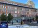 Historical brick building featuring intricate architectural details and street-level retail spaces at 1555 California St # 302, Denver, CO 80202
