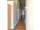 Long hallway with hardwood floors and high ceilings leading to multiple rooms at 1555 California St # 302, Denver, CO 80202