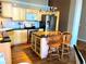 Contemporary kitchen features light wood cabinets, granite countertops, and stainless steel appliances at 1555 California St # 302, Denver, CO 80202
