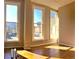 Sunlit living space with large windows, hardwood floors, and views of the city at 1555 California St # 302, Denver, CO 80202