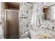 The bathroom features retro wallpaper at 8100 W 8Th Ave, Lakewood, CO 80214