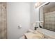Bathroom features updated lighting and decor at 8100 W 8Th Ave, Lakewood, CO 80214