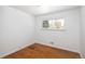 Bright bedroom with a light color paint and hardwood floors and a window view at 8100 W 8Th Ave, Lakewood, CO 80214
