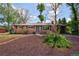 Charming single-story brick home with manicured front yard and inviting front door at 8100 W 8Th Ave, Lakewood, CO 80214