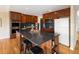 Kitchen featuring stainless steel appliances, dark countertops, wood cabinets, and a large kitchen island with seating at 8100 W 8Th Ave, Lakewood, CO 80214