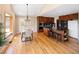 Kitchen and dining area with hardwood floors, island with breakfast bar, stainless steel appliances, and vaulted ceilings at 8100 W 8Th Ave, Lakewood, CO 80214