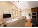 Bright living room and kitchen area with hardwood floors and large bay window at 8100 W 8Th Ave, Lakewood, CO 80214