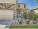 Charming front porch with stone accents and well-manicured landscaping at 12734 E 104Th Pl, Commerce City, CO 80022