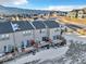 Aerial view of townhouses with private decks and mountain backdrop at 909 Burning Bush Pt, Monument, CO 80132