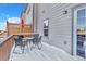 Back deck with table and chairs sitting on snow at 909 Burning Bush Pt, Monument, CO 80132