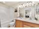 Bathroom featuring double sinks, a large mirror, and a bathtub and shower combination at 909 Burning Bush Pt, Monument, CO 80132