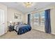 Bedroom featuring vaulted ceilings, carpeted floors, a modern ceiling fan, and natural light at 909 Burning Bush Pt, Monument, CO 80132