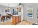 Open-concept dining area near kitchen offering views of the back yard area at 909 Burning Bush Pt, Monument, CO 80132