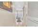 Light and airy entryway with hardwood flooring, a decorative rug, and a white front door with glass at 909 Burning Bush Pt, Monument, CO 80132