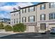 Inviting townhome featuring a neutral exterior, two-car garage, and well-maintained landscaping at 909 Burning Bush Pt, Monument, CO 80132