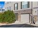 Close up townhome exterior featuring stone accents, neutral siding, and a well-maintained front yard at 909 Burning Bush Pt, Monument, CO 80132