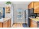 Bright kitchen with wood cabinets, black appliances, and a window at 909 Burning Bush Pt, Monument, CO 80132