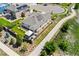 Aerial view of the home's backyard, deck, well-kept lawn, and patio area at 15525 Quince Cir, Thornton, CO 80602
