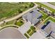 A beautiful aerial view of the home, its well-manicured lawn, and the surrounding neighborhood at 15525 Quince Cir, Thornton, CO 80602