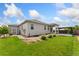 Exterior backyard featuring a gazebo, nice lawn, and landscaping at 15525 Quince Cir, Thornton, CO 80602