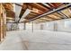 Unfinished basement with concrete floors, visible ductwork, and exposed ceilings at 15525 Quince Cir, Thornton, CO 80602