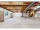 Spacious unfinished basement with exposed ceiling and concrete flooring at 15525 Quince Cir, Thornton, CO 80602