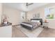 Bedroom with gray bed, nightstands, carpet, and natural light at 15525 Quince Cir, Thornton, CO 80602