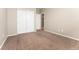 Bedroom featuring neutral walls, plush carpet, and ample closet space at 15525 Quince Cir, Thornton, CO 80602