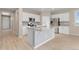 Spacious kitchen features white cabinets, granite countertops and stainless steel appliances at 15525 Quince Cir, Thornton, CO 80602