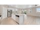 Modern kitchen features stainless steel appliances, granite countertops, and backyard views at 15525 Quince Cir, Thornton, CO 80602