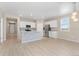 Spacious kitchen with gray island, stainless steel appliances, and hardwood floors at 15525 Quince Cir, Thornton, CO 80602
