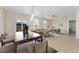 Bright living room featuring hardwood floors, neutral paint, modern furnishings, and large windows at 15525 Quince Cir, Thornton, CO 80602