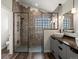This bathroom features a stand up shower with sleek fixtures and a double sink vanity at 6055 W Progress Ave, Littleton, CO 80123