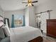 This bedroom is full of natural light and a sliding barn door to the main bathroom at 6055 W Progress Ave, Littleton, CO 80123