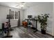 This bedroom is equipped with an exercise bike at 6055 W Progress Ave, Littleton, CO 80123