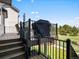 Outdoor deck space with a grill and comfortable seating, perfect for enjoying the backyard view at 6055 W Progress Ave, Littleton, CO 80123