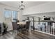 Cozy dining area with a view and modern light fixture near the living room at 6055 W Progress Ave, Littleton, CO 80123