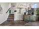 Welcoming entryway with staircase leading to the kitchen and living areas at 6055 W Progress Ave, Littleton, CO 80123