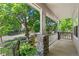 Inviting front porch with stone accents, offering a cozy outdoor space and neighborhood views at 6055 W Progress Ave, Littleton, CO 80123
