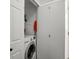 This laundry room is fully equipped with a washer at 6055 W Progress Ave, Littleton, CO 80123