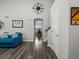 Open floor plan with view from living room featuring modern flooring leading to adjacent dining area at 6055 W Progress Ave, Littleton, CO 80123