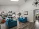Bright living room featuring vaulted ceilings, skylight, modern flooring and contemporary furnishings at 6055 W Progress Ave, Littleton, CO 80123