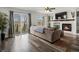 Spacious living room with fireplace, balcony access, and natural light at 6055 W Progress Ave, Littleton, CO 80123