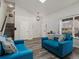 Bright living room with modern flooring and high ceilings, complemented by contemporary furnishings at 6055 W Progress Ave, Littleton, CO 80123