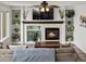Inviting living room with fireplace, built-in shelves, and comfortable seating at 6055 W Progress Ave, Littleton, CO 80123