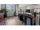 This home office features wood floors and views of the landscape at 6055 W Progress Ave, Littleton, CO 80123
