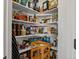 Well-stocked pantry with organized shelving and various food items at 6055 W Progress Ave, Littleton, CO 80123