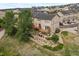 An aerial view showcasing a tan townhouse with deck at 985 Burning Bush Pt, Monument, CO 80132