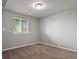 Finished basement room with carpet and window at 985 Burning Bush Pt, Monument, CO 80132