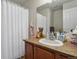 Clean bathroom with shower, vanity, and linen storage at 985 Burning Bush Pt, Monument, CO 80132